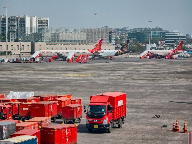 Hans Air Express cargo vehicles at Mumbai airport for international shipments