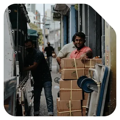 Hans Air Express delivery worker handling a domestic parcel for doorstep courier service in Mumbai